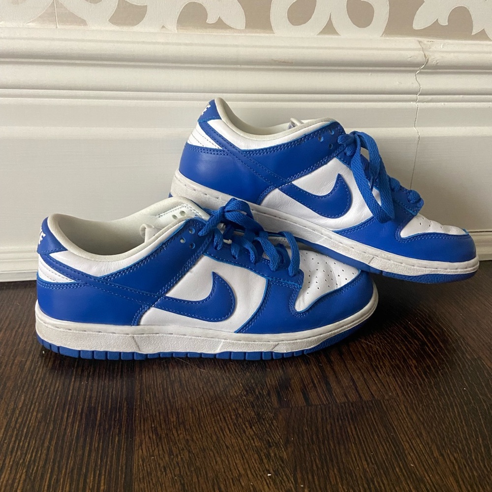 Nike Blue and White Sneakers with Lace-Up Closure and Bold Design